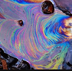 Optical satellite view of an iridescent oil slick off Corsica